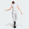 IN6178_23_hover_model.jpg Pantalones holgados de vellón de 3 bandas Adidas Essentials para mujer-