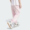 JE1272_23_hover_model.jpg Pantalones holgados de vellón de 3 bandas Adidas Essentials para mujer-