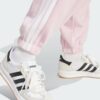 JE1272_42_detail.jpg Pantalones holgados de vellón de 3 bandas Adidas Essentials para mujer-