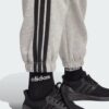 JE1273_41_detail.jpg Pantalones holgados de vellón de 3 bandas Adidas Essentials para mujer-