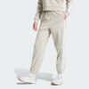 JX7697_000_plp_model.jpgJX7697_000_plp_model.jpg Pantalones holgados de vellón de 3 bandas Adidas Essentials para mujer-