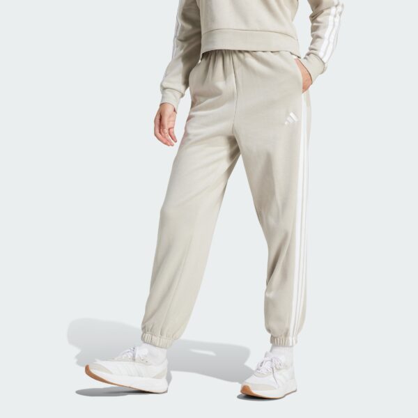 JX7697_000_plp_model.jpgJX7697_000_plp_model.jpg Pantalones holgados de vellón de 3 bandas Adidas Essentials para mujer-