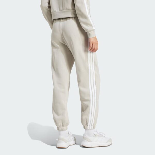 JX7697_23_hover_model.jpg Pantalones holgados de vellón de 3 bandas Adidas Essentials para mujer-