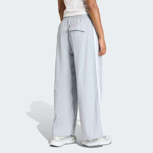 Pantalones de paracaídas tejidos estilo de vida Adidas Essentials 3 bandas para mujer-