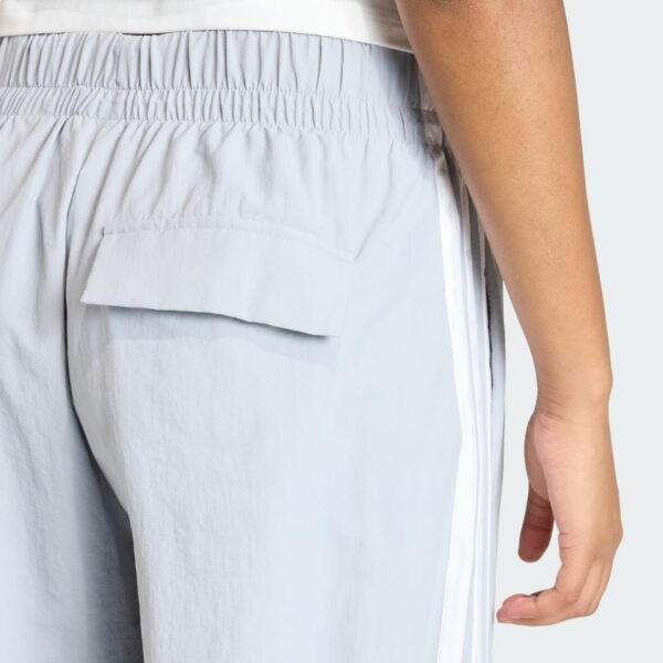Pantalones de paracaídas tejidos estilo de vida Adidas Essentials 3 bandas para mujer-
