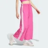 Pantalones de paracaídas tejidos estilo de vida Adidas Essentials 3 bandas para mujer-